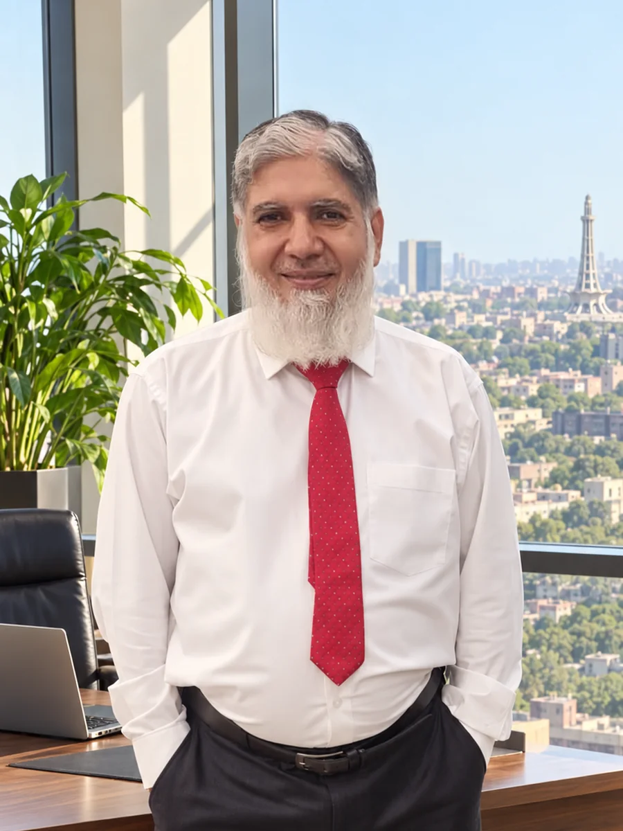 Tuyyab Bukhari in his office in Lahore with the city skyline behind him